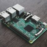 Detailed view of a Raspberry Pi circuit board with microchips and components.